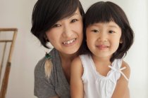 Mother and daughter smiling, portrait — Stock Photo