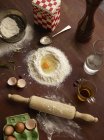 Still life of baking preparation with flour and eggs — Stock Photo