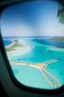 Airplane over society islands — Stock Photo