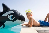 Boy by swimming pool — Stock Photo
