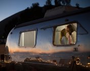 Couple kissing in trailer — Stock Photo