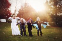 Group of friends in Halloween costumes — Stock Photo