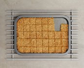 Tray of flapjacks with some missing piece — Stock Photo