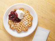 Waffle with cream and cherries — Stock Photo