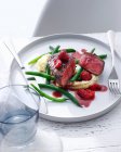 Plate of filet with green beans — Stock Photo