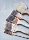 High angle view of various sized paintbrushes — Stock Photo