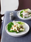 Plates of salad with chicken — Stock Photo
