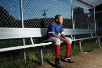 Teenage boy watching from the sidelines — Stock Photo