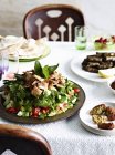 Still life with served table of falafel and salad — Stock Photo