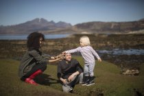 Mother showing son rock, Isle of Skye, Hebrides, Scotland — Stock Photo