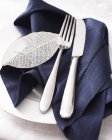 High angle view of knife fork and napkin on place setting — Stock Photo