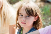 Pensive girl looking at camera, portrait — Stock Photo
