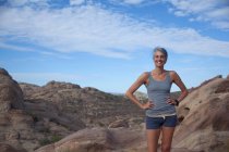 Woman standing at Vazquez Rocks with hands on hips — Stock Photo