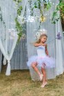 Portrait of young girl, dressed as fairy, holding butterfly wand — Stock Photo