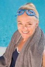 Portrait of Mature woman by swimming pool — Stock Photo
