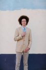 Portrait of teenage boy with red afro hair, wearing suit, outdoors — Stock Photo