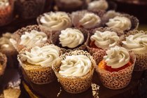 Decorated cupcakes on plate — Stock Photo