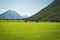 Sports field in rural landscape — Stock Photo