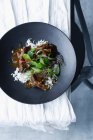 Bowl of braised beef cheeks and rice — Stock Photo