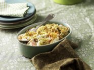 Root vegetable gratin in dish on table — Stock Photo