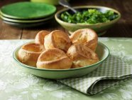 Yorkshire puddings in vintage green bowl — Stock Photo