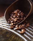 Fresh coffee beans in vintage scoop — Stock Photo