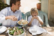 Father and son dining al fresco — Stock Photo