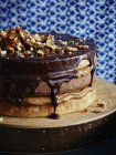 Triple layer chocolate caramel cake with walnuts — Stock Photo