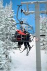 Couple on a ski lift — Stock Photo