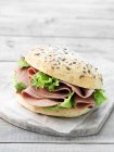 Liver sausage with lettuce sandwich in seeded bun — Stock Photo