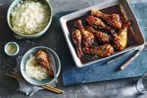 Sticky Honey Soy Chicken with rice portions — Stock Photo