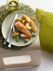 Plate of roasted fish with potatoes — Stock Photo