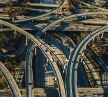 Aerial view of curved flyovers and highways in sunlight — Stock Photo