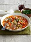 Bowl of lamb risoni soup on table — Stock Photo