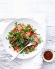 Bowl of Chinese pork salad with sauce — Stock Photo