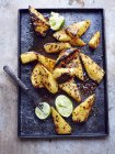Tray of grilled pineapple with lime — Stock Photo