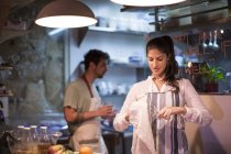 Restaurant owners working in kitchen — Stock Photo