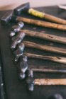 Row of hammers placed on forge workbench — Stock Photo