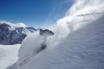 Male freestyle skier skiing down snow powdered mountainside, Zugspitze, Bayern, Germany — Stock Photo