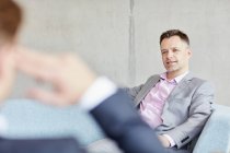 Two businessmen meeting in office — Stock Photo