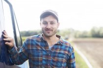 Portrait of farmer looking at camera smiling — Stock Photo