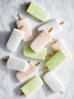 Top view of ice cream popsicles on marble surface — Stock Photo