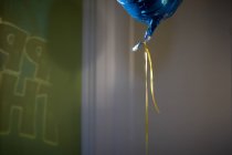Birthday balloon hanging in air — Stock Photo