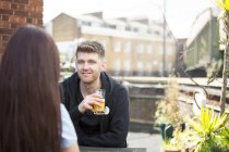 Young couple chatting on terrace — Stock Photo