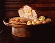 Roasted leg of lamb with stuffing and new potatoes — Stock Photo