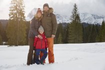 Portrait of parents and son in snow covered landscape, Elmau, Bavaria, Germany — Stock Photo