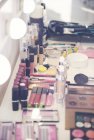 Variety of make up in dressing room — Stock Photo