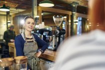 Caucasian female barista at work — Stock Photo