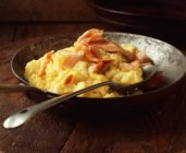 Salmon and mashed potatoes in vintage metal frying pan — Stock Photo