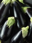 Pile of whole ripe aubergines, top view — Stock Photo